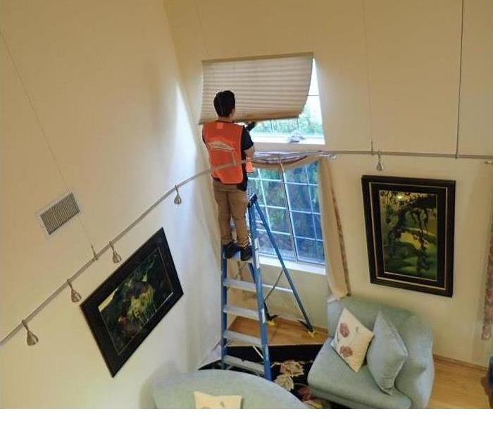 man cleaning a house