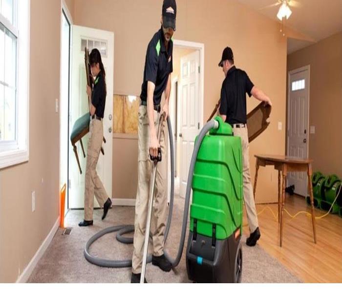 People cleaning a room
