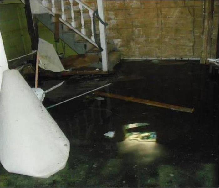 dark basement, wet floor. Concept storm flooding in a home